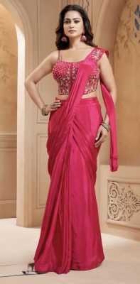 Elegant Hot Pink saree with a sleek, fluid crepe silk pre stitched saree drape, paired with a beautifully gold embroidered noodle strap corset blouse. Perfect for weddings and festive occsions