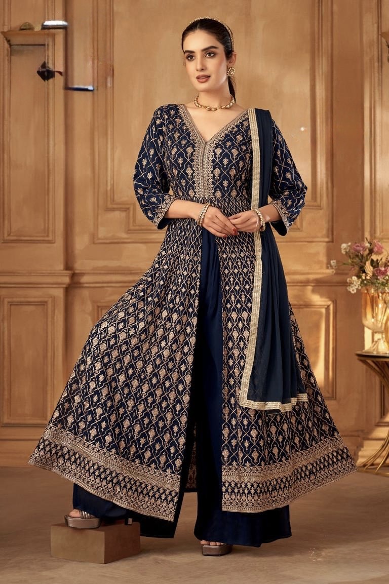 9f9ab3d6-f2f4-4a0e-a450-0f1932a8cbd2 Elegant Navy Blue Anarkali Indo western gown suit with delicate thread embroidery . Paired with matching gerogette flowy palazzo pants and coordinated with matching dupatta, this timeless ensemble is perfect for weddings and festive occasions